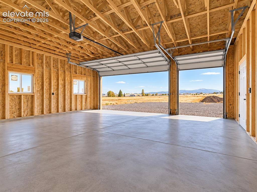 Image 31 of 34: Detached Garage Interior – Spacious detached garage features multiple overh