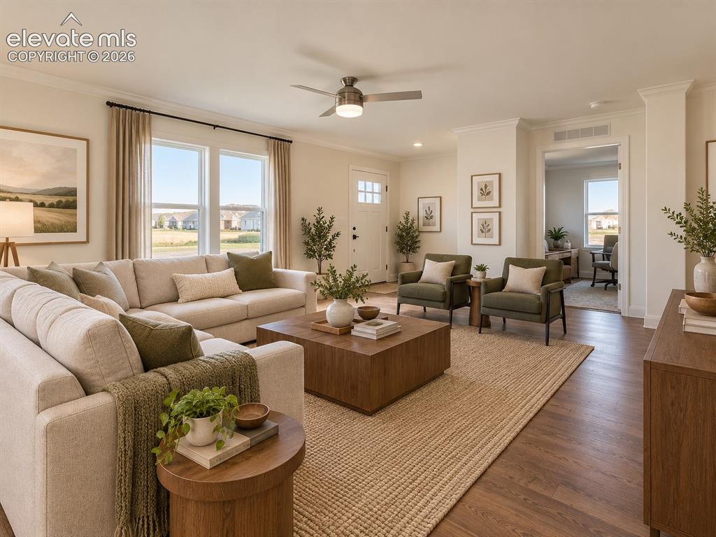Image 4 of 34: Living Room – Bright living room offers generous seating space, large windo