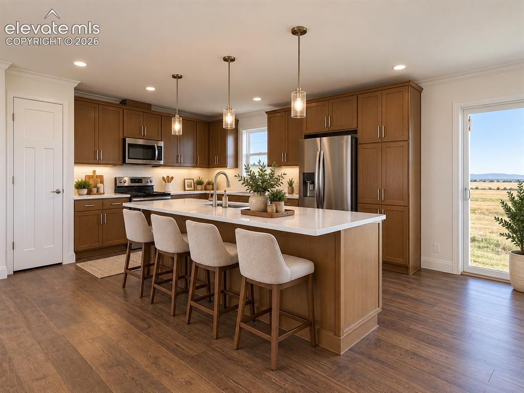Image 6 of 34: Kitchen – Well-appointed kitchen centers around a substantial island with s
