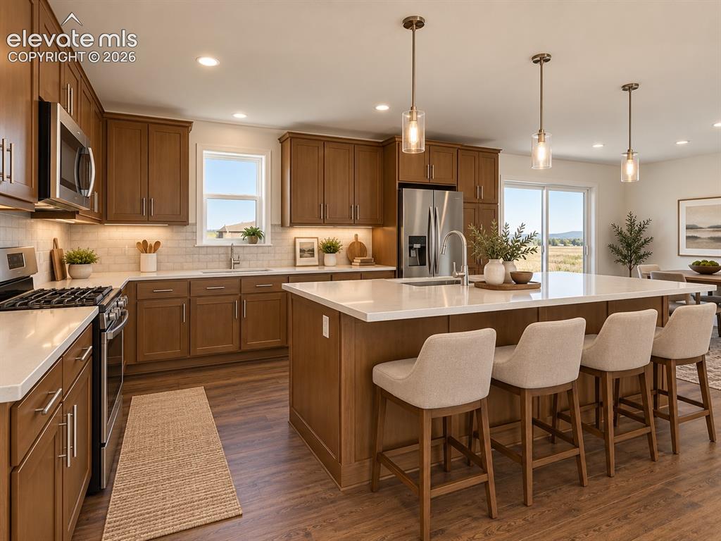 Image 7 of 34: Kitchen – Another view highlights the expansive island, abundant cabinet st