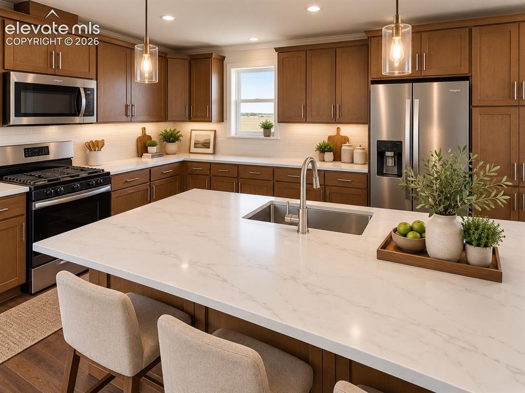 Image 9 of 34: Kitchen – Close-up kitchen view showcases an oversized island with sink and