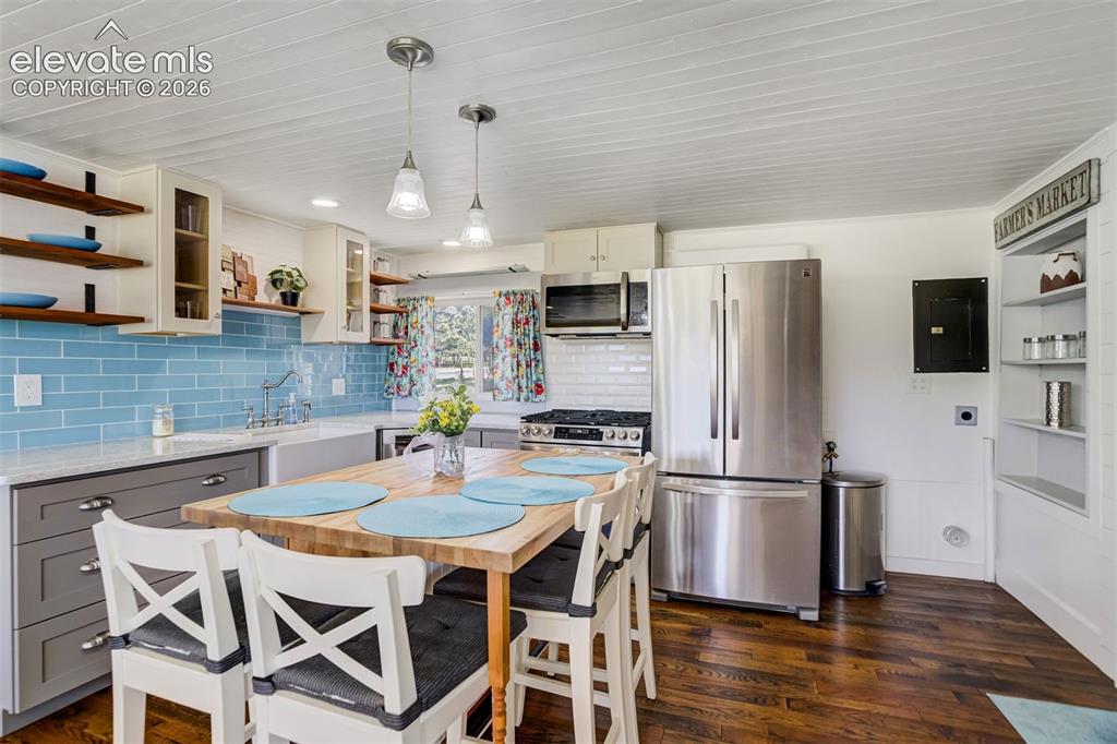 Image 10 of 37: The space next to the refrigerator is for the stackable washer & dryer