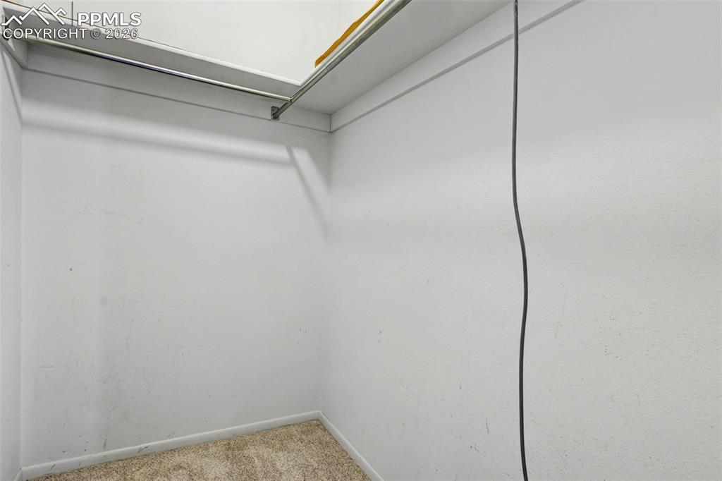 Image 19 of 38: Main level 2nd bedroom walk in closet