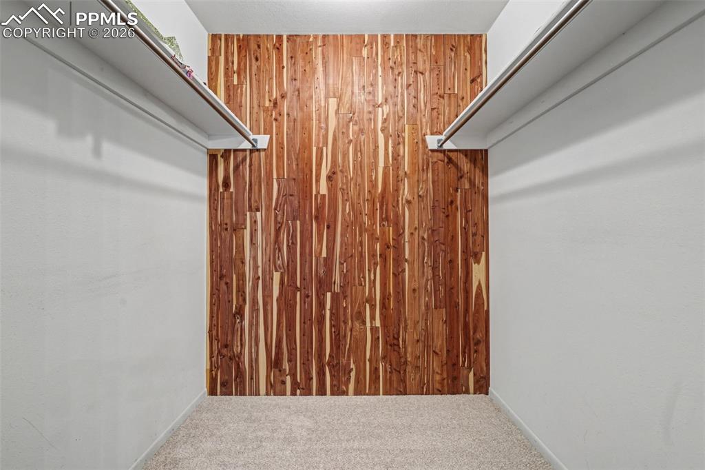 Image 23 of 38: Primary walk in cedar closet (also linen closet in primary)