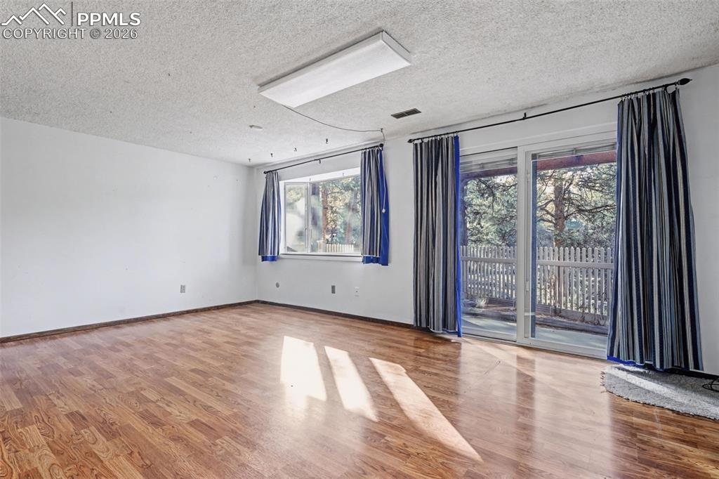 Image 25 of 38: Wood burning fireplace