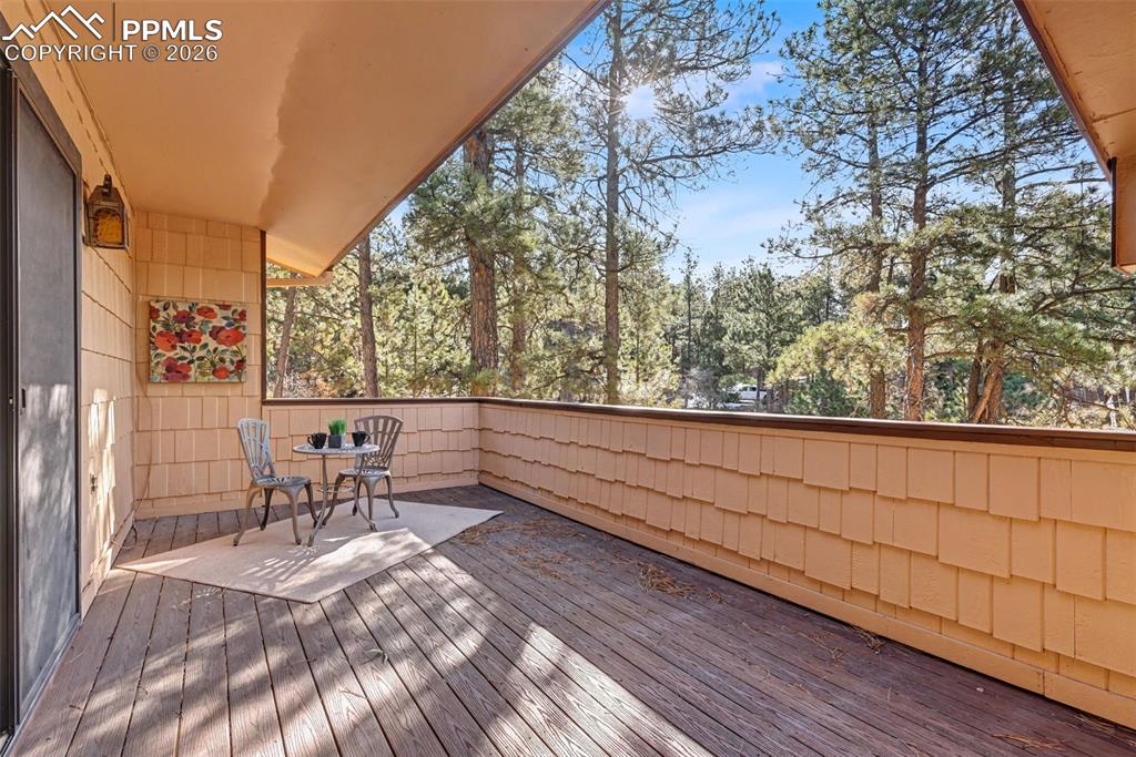 Image 34 of 38: Large upper deck with entry to foyer