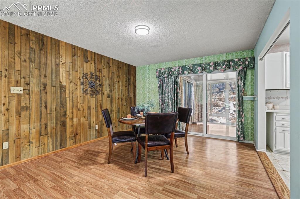 Image 7 of 38: Access to permitted sun room and walk out to back yard