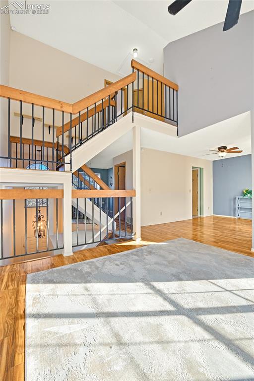 Image 10 of 32: Living/Great Room, Staircase, And Formal Dining Room