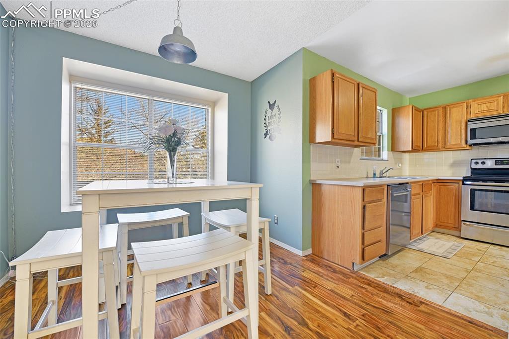 Image 14 of 32: Kitchen Showing Kitchen Dining Area (Plus There Is A Formal Dining Room)
