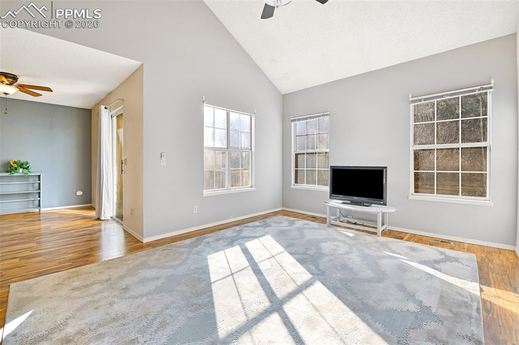 Image 8 of 32: Living/Great Room With View Into Formal Dining Room