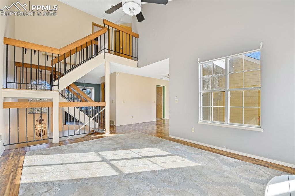 Image 9 of 32: Living/Great Room With Views Of Staircase And Into The Formal Dining Room