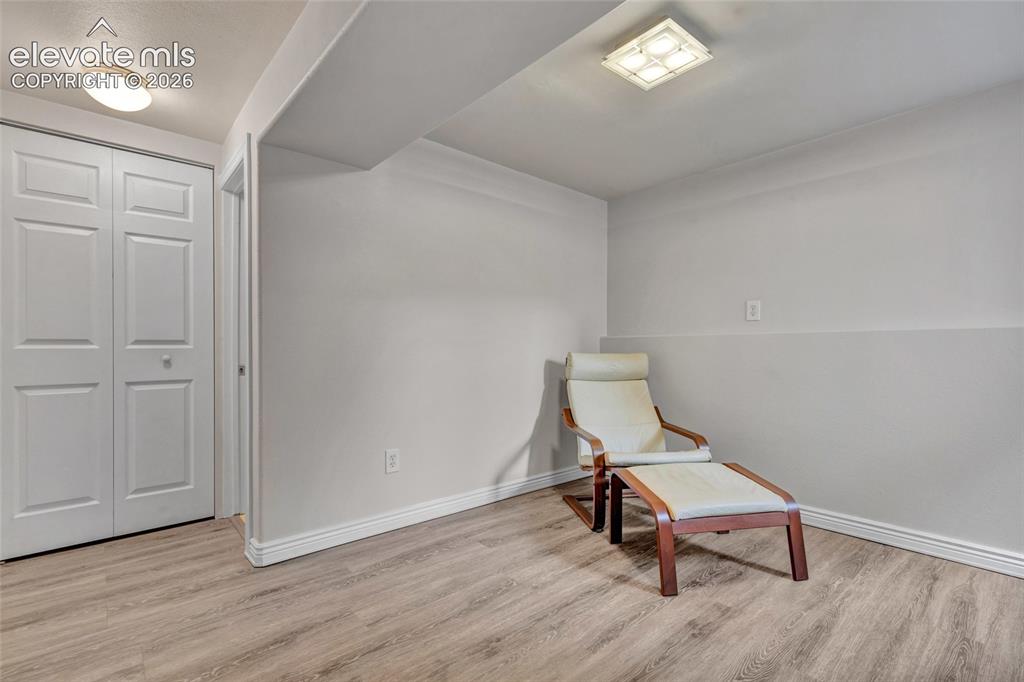 Image 29 of 44: Room featuring light wood-finish flooring and white baseboards