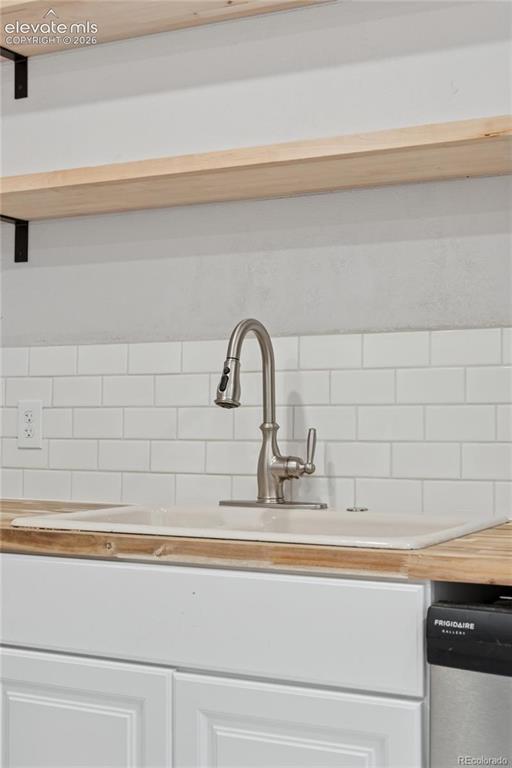 Image 17 of 49: Main-level flat kitchen