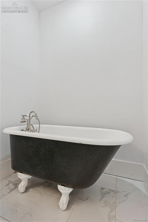 Image 22 of 49: Main-level flat 2nd full
bath with clawfoot tub
and shower attachment