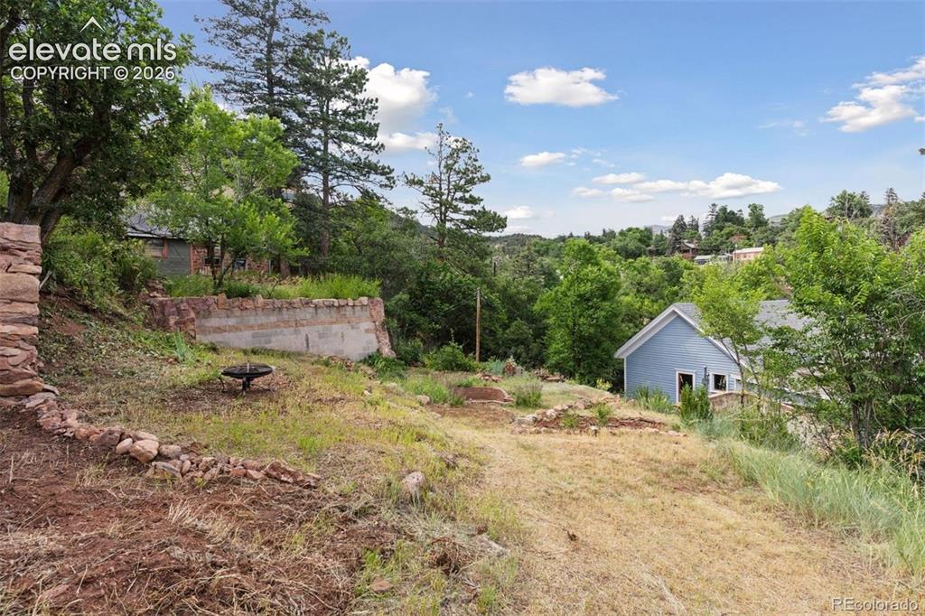 Image 40 of 49: Backyard has ample
space for stargazing,
relaxing and more