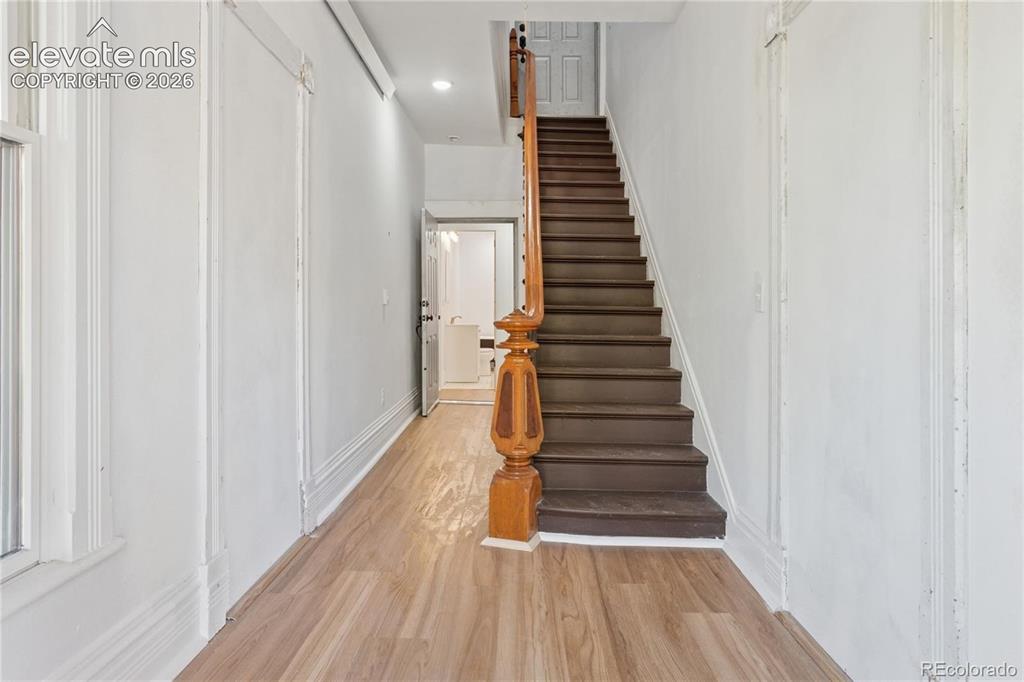 Image 7 of 49: Entry hall, period
stairway to upper flat