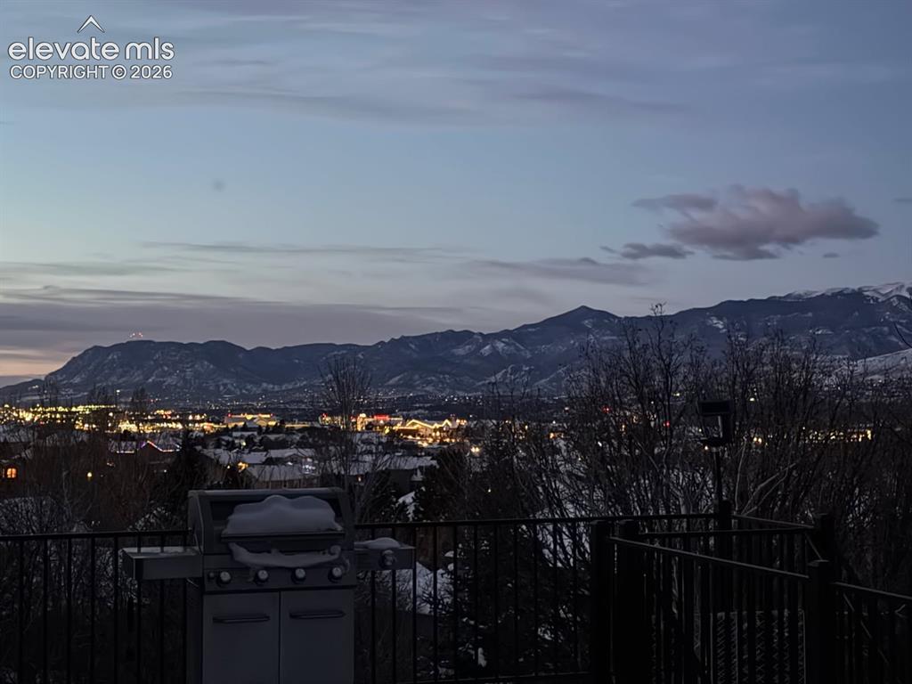 Image 37 of 40: City lights with mountain views from deck