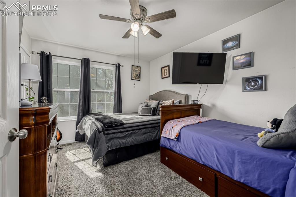 Image 21 of 47: Bedroom featuring carpet flooring and a ceiling fan