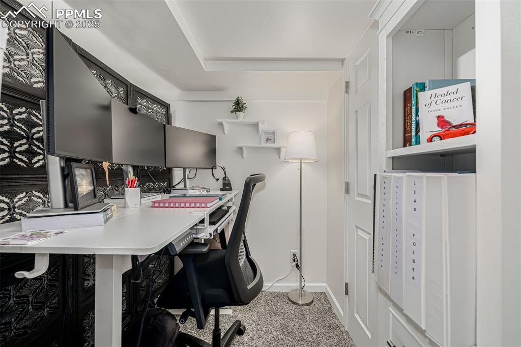 Image 23 of 47: Office area featuring baseboards and light carpet
