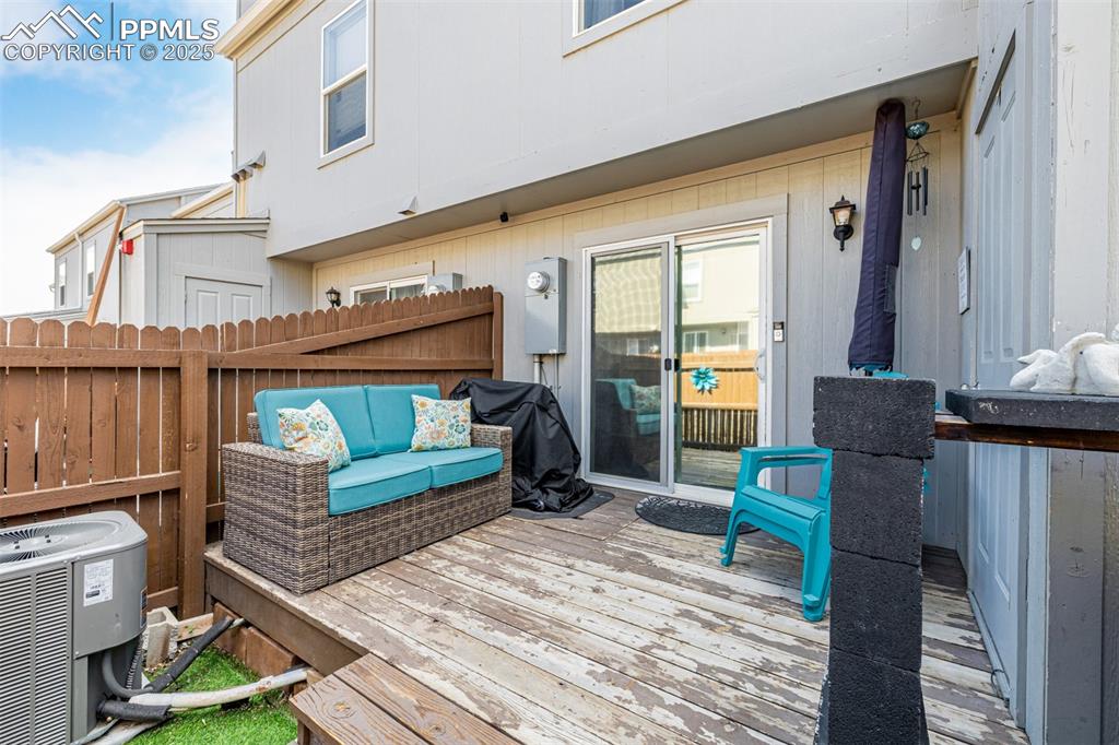 Image 28 of 47: Deck with an outdoor hangout area