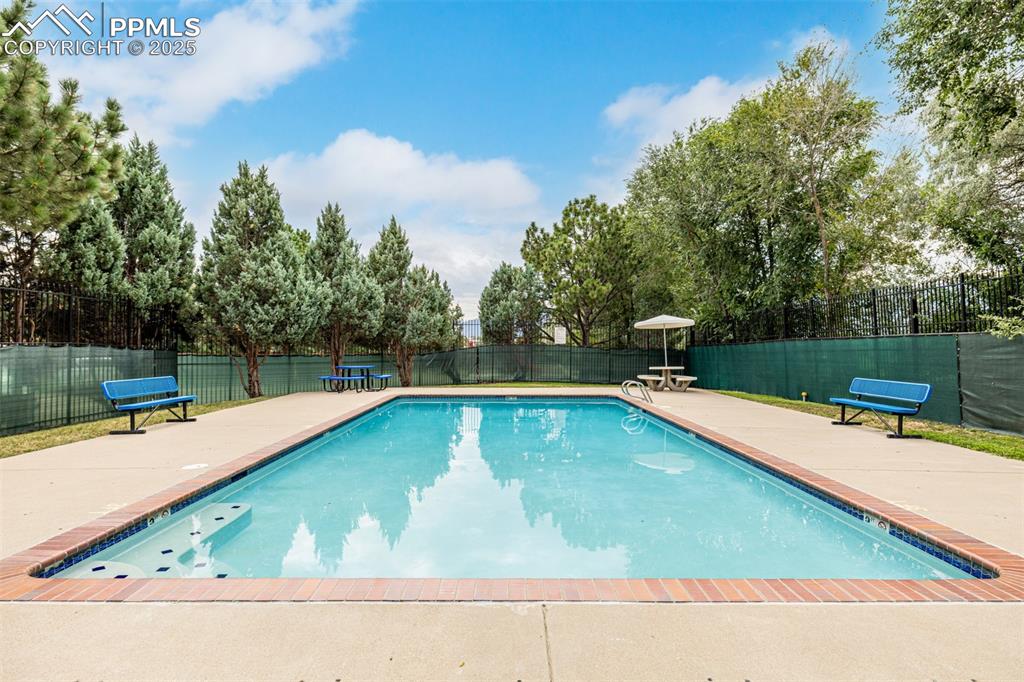 Image 32 of 47: View of swimming pool with a patio