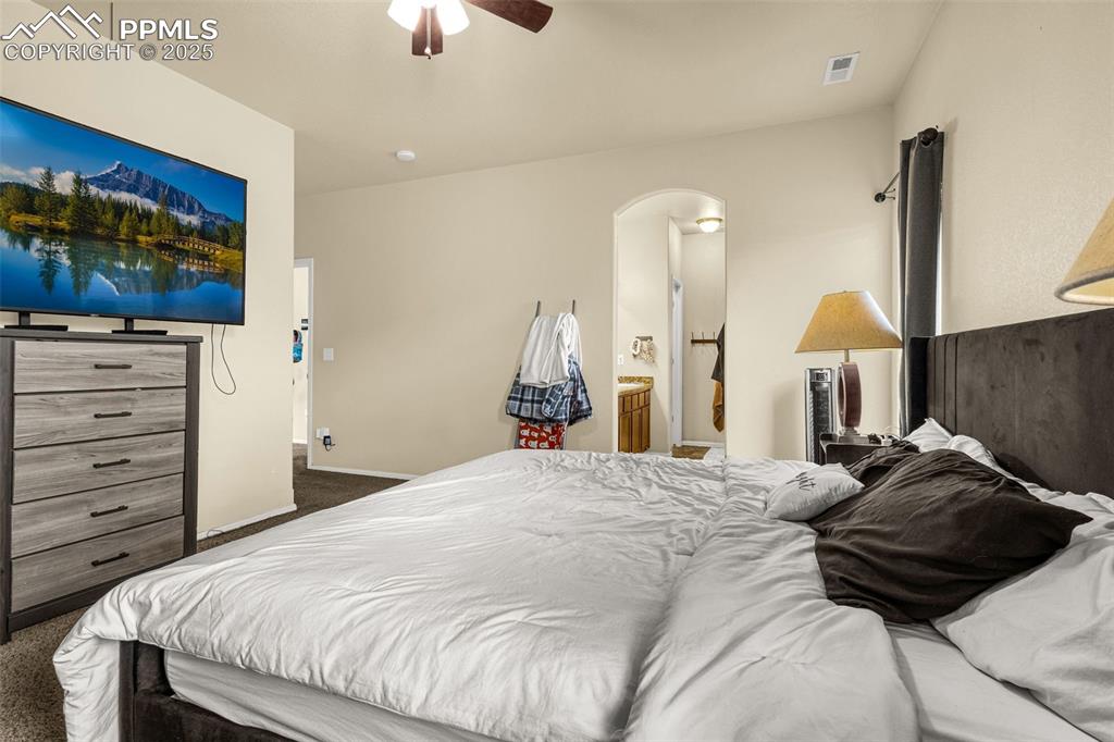 Image 18 of 31: Primary bedroom with 5-piece bathroom. 