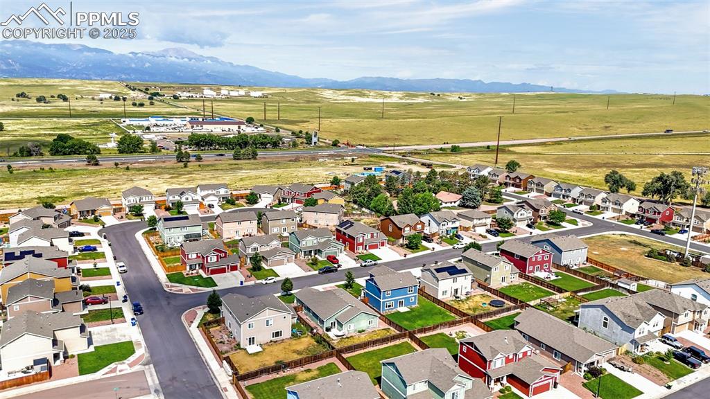 Image 30 of 31: Aerial view of residential area with mountains.  Allowing easy access to Po