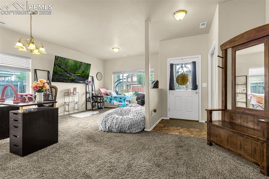 Image 4 of 31: Bright and open home has lots of natural light afforded by the large window