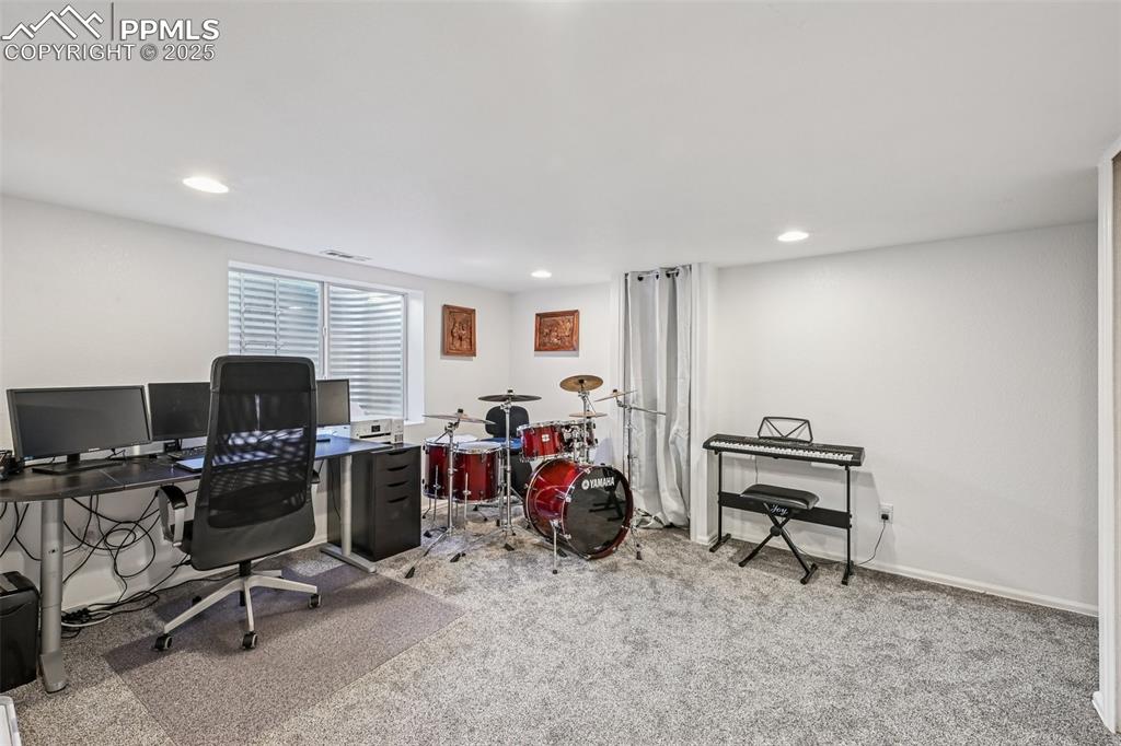 Image 25 of 38: Office featuring light colored carpet and recessed lighting