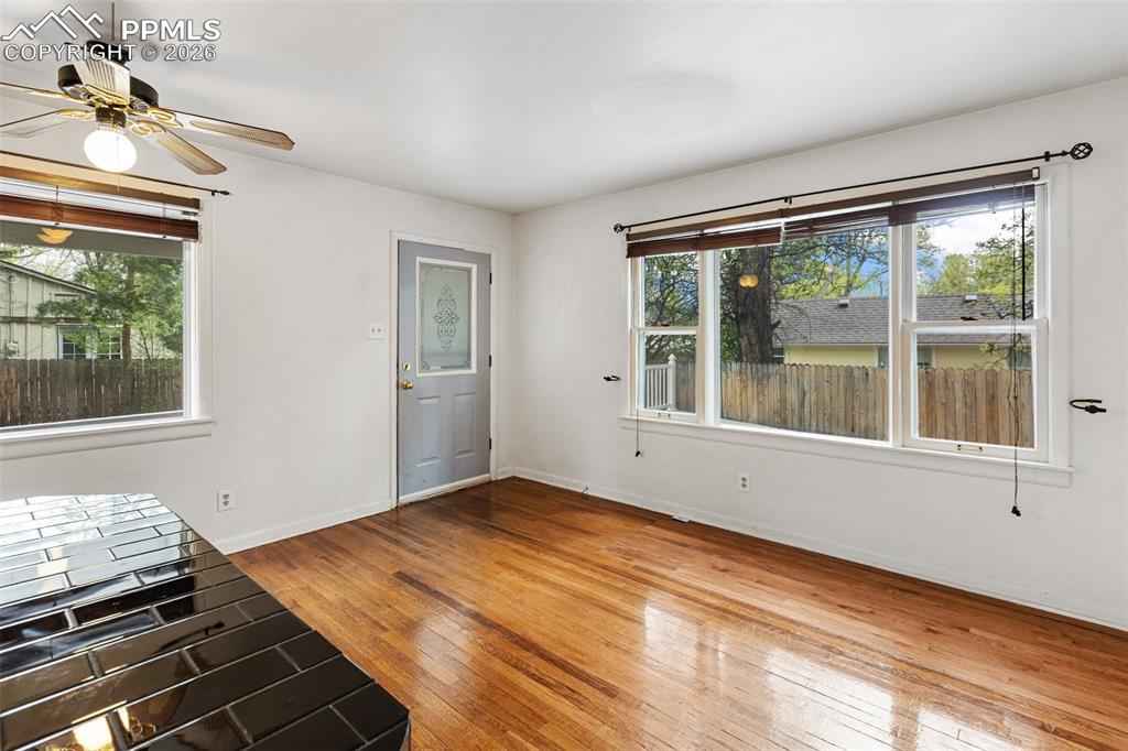 Image 16 of 49: Living room features real wood flooring