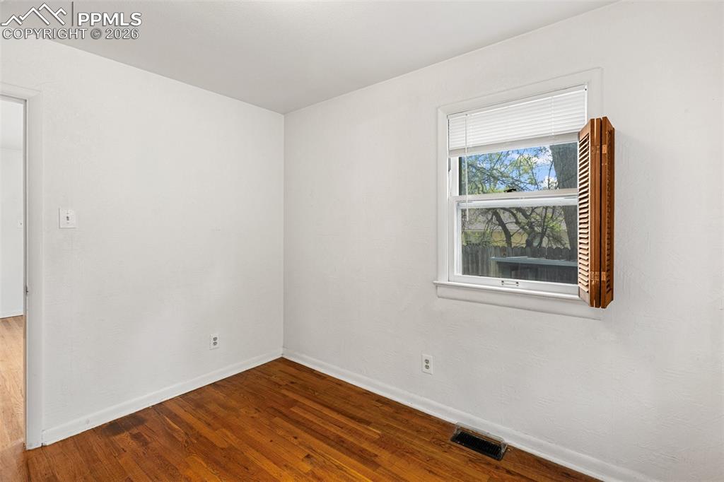 Image 28 of 49: One of 2 bedrooms featuring hardwood floors