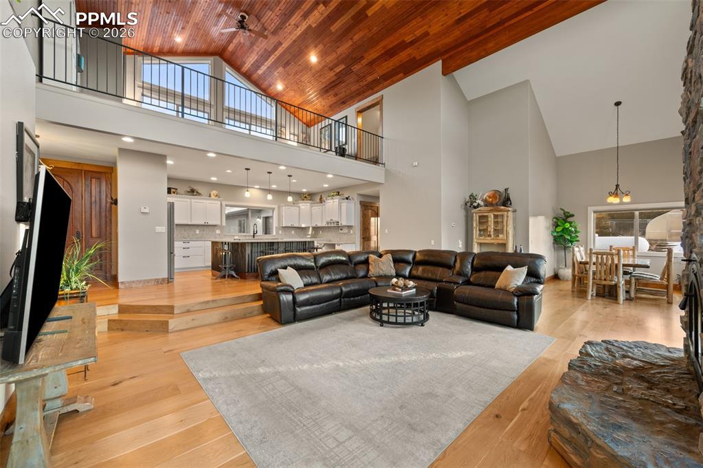 Image 10 of 50: Living room with view of wood vaulted ceilings
