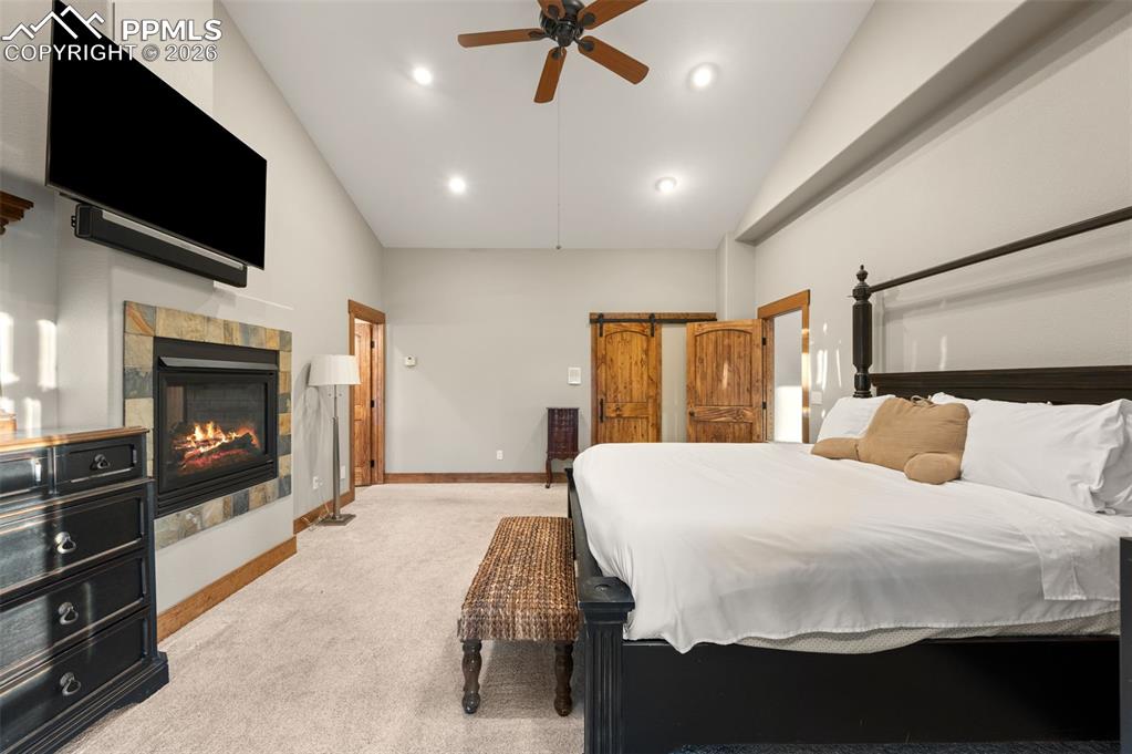 Image 16 of 50: Master bedroom with gas fireplace to use from bedroom or bathroom