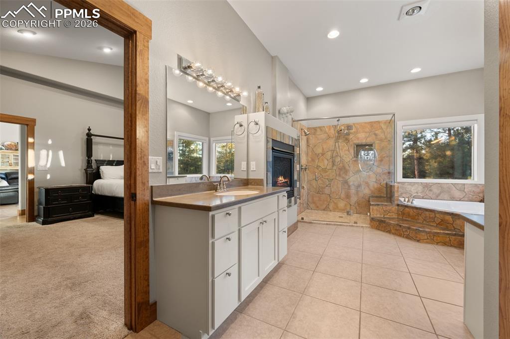 Image 18 of 50: Master bathroom with double shower and rain shower. Double large vanities