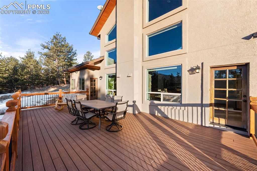 Image 41 of 50: Beautiful back deck, generously sized with view of completely renovated ext