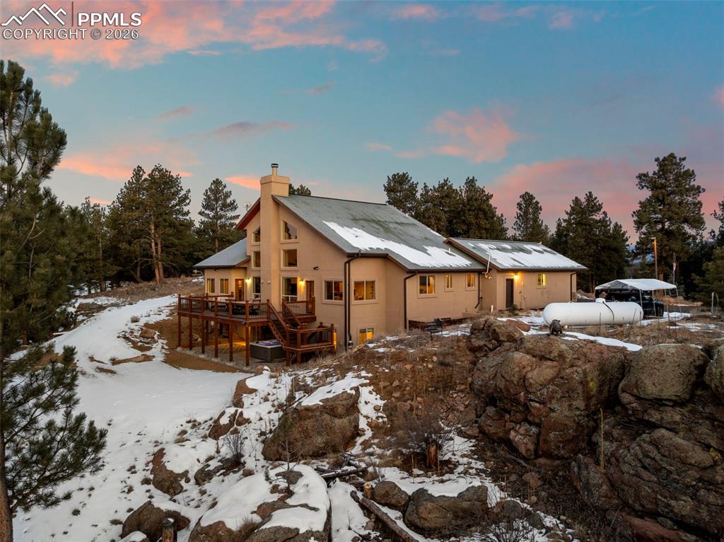 Image 42 of 50: Back of house with view of all of the rock formations to be seen all throug