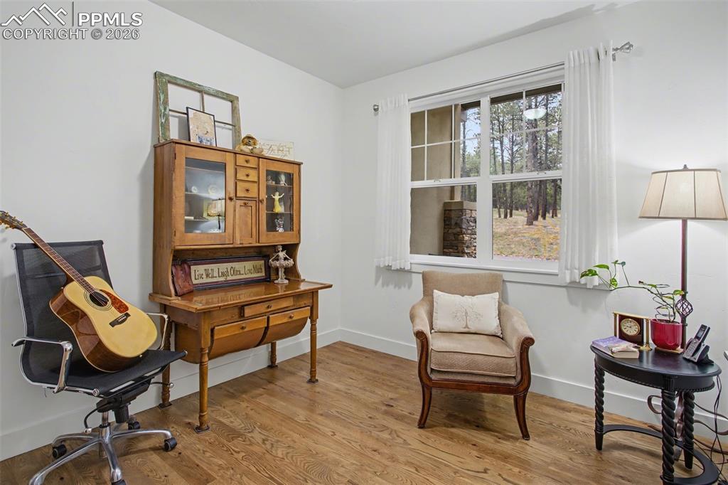 Image 21 of 41: Front office that could be a fourth bedroom