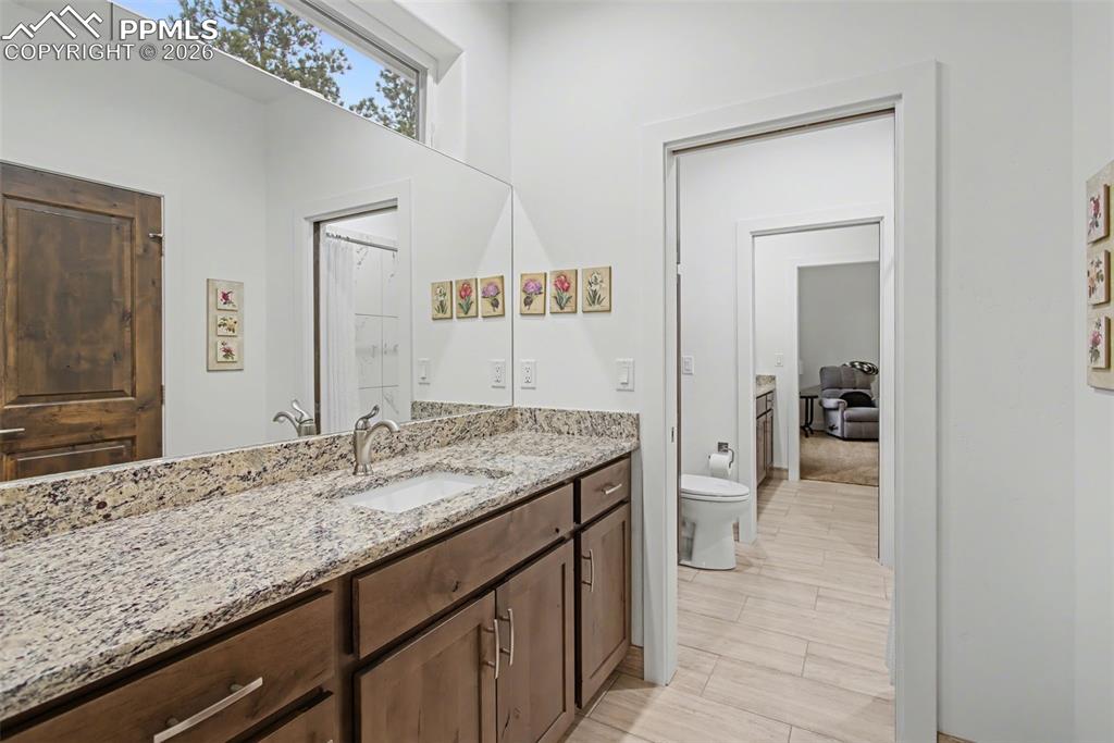 Image 25 of 41: Jack and Jill bathroom between bedrooms each with their own sink area