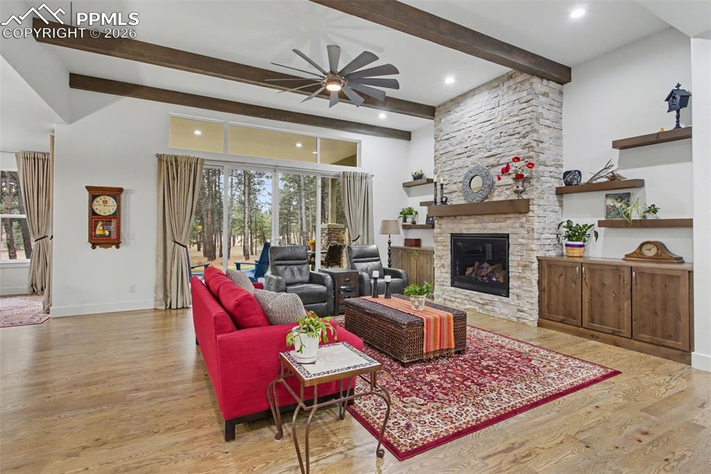 Image 6 of 41: Oversized gas fireplace and built-ins are just some of the custom features