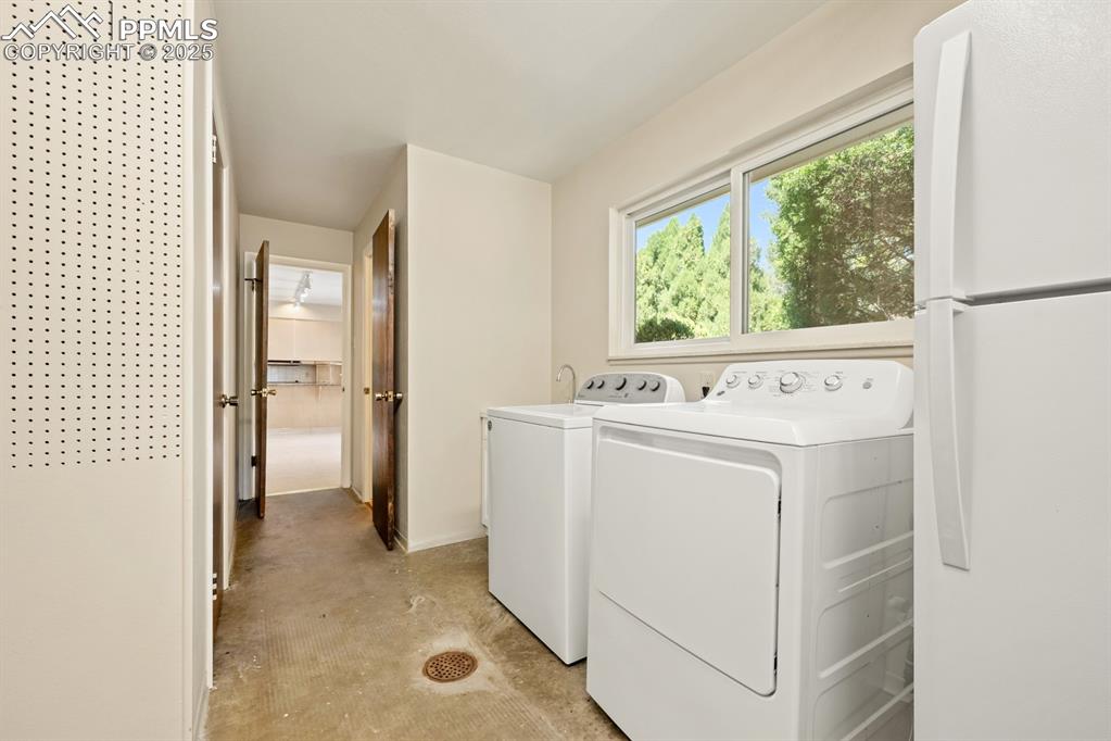 Image 26 of 50: Washroom with independent washer and dryer