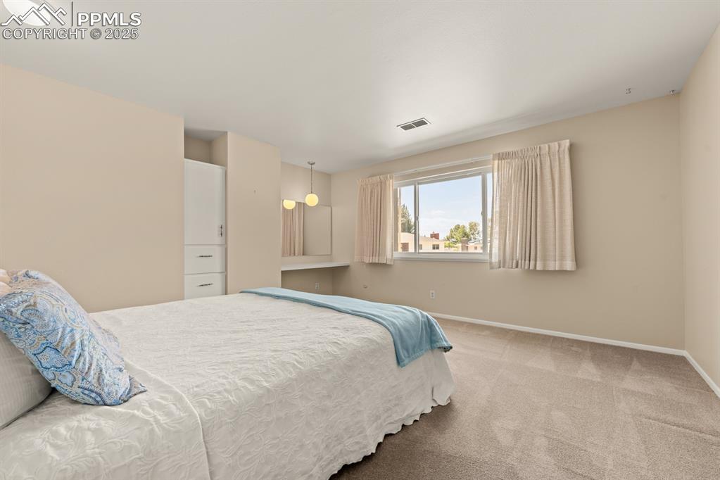 Image 38 of 50: Bedroom featuring carpet flooring and baseboards