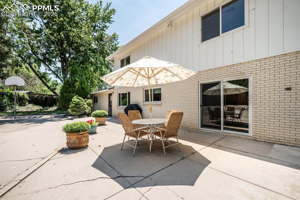 Image 48 of 50: View of patio / terrace featuring outdoor dining space and a grill