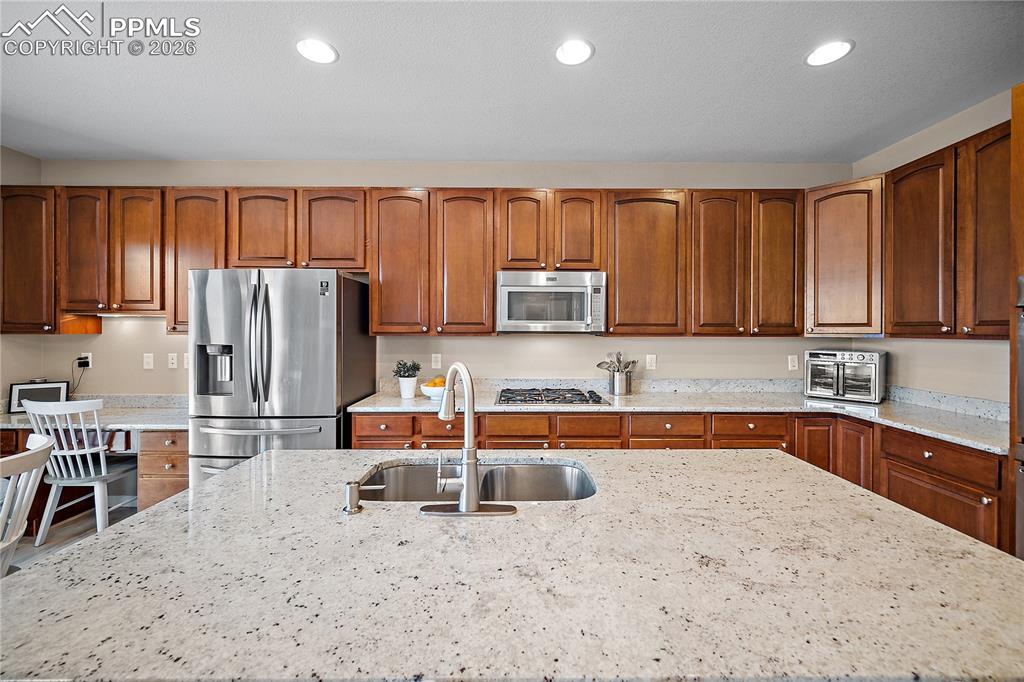 Image 16 of 48: Tons of cabinet and counter space. As well as a work space. 