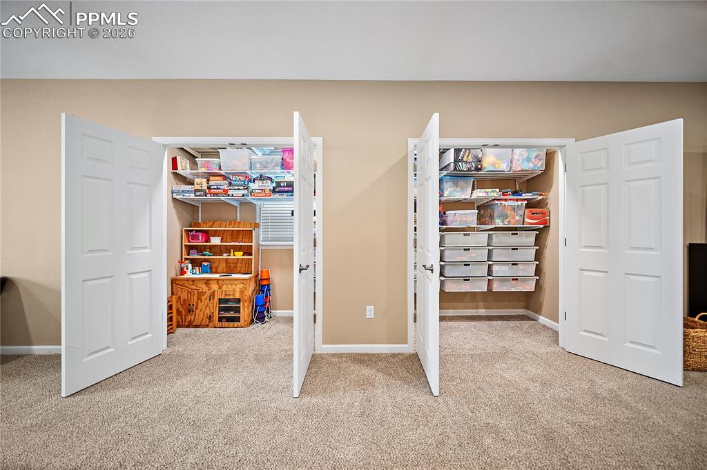 Image 35 of 48: Huge walk-in game closet. 