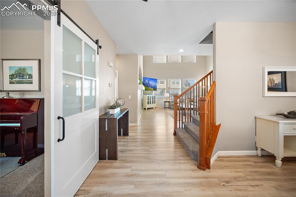 Image 4 of 48: Main entry, to the right is the formal dining and to the left is office or 