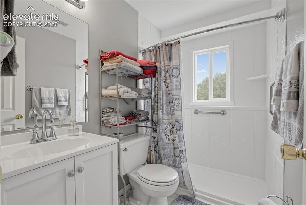 Image 11 of 27: lower level bathroom
