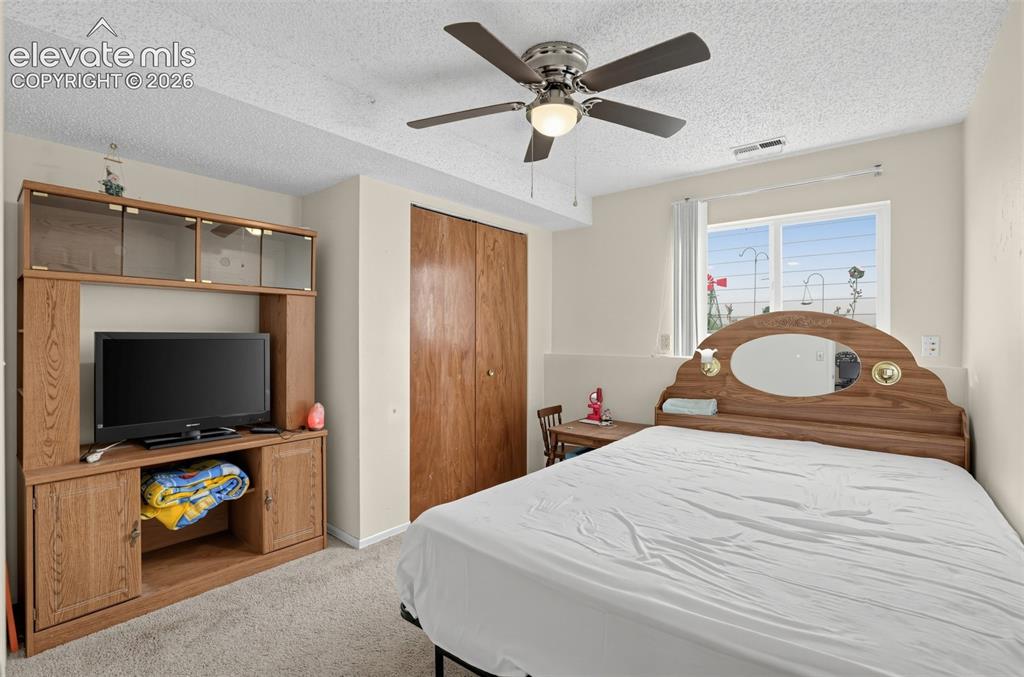 Image 12 of 27: lower bedroom