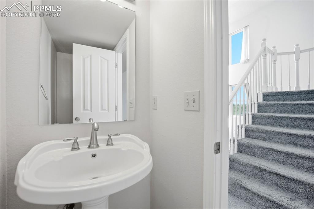 Image 20 of 50: 2nd main level half bathroom