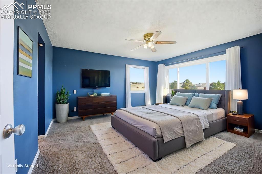 Image 24 of 50: Virtually staged primary bedroom