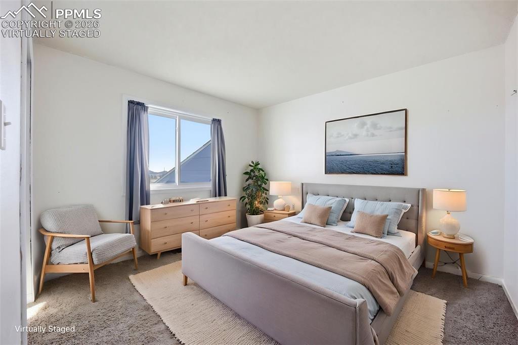 Image 31 of 50: Virtually staged upper 3rd bedroom